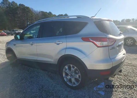 2016 Ford Escape Titanium z USA, uszkodzony, nr VIN 1FMCU0JX1GUA26165